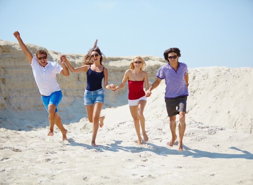 People running on the beach